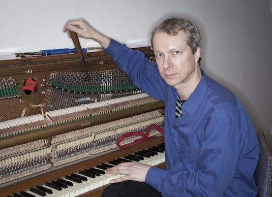 Johannes Bergmark tuning an upright piano. Photo © by Andrzej Markiewicz